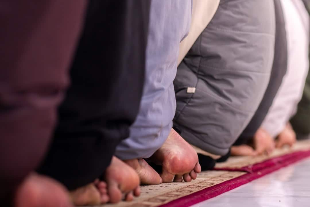 Muslim children studying the Quran remotely.